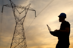 Image of a lineworker assessing a power line