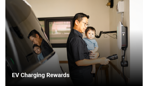 man with son charging car